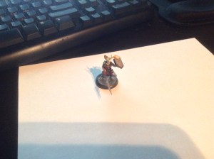 A metal mini glued to a plastic base that I painted myself.