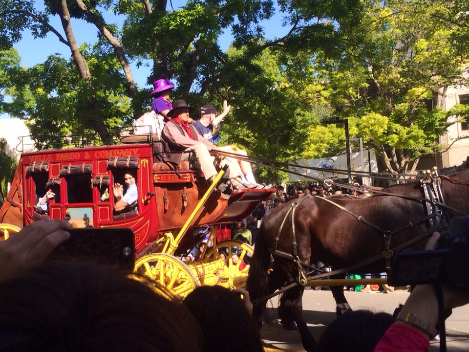 A Wells Fargo carriage pulled by a four horses. The lady in the purple hat was the best speaker for the opening of Picnic Day.
