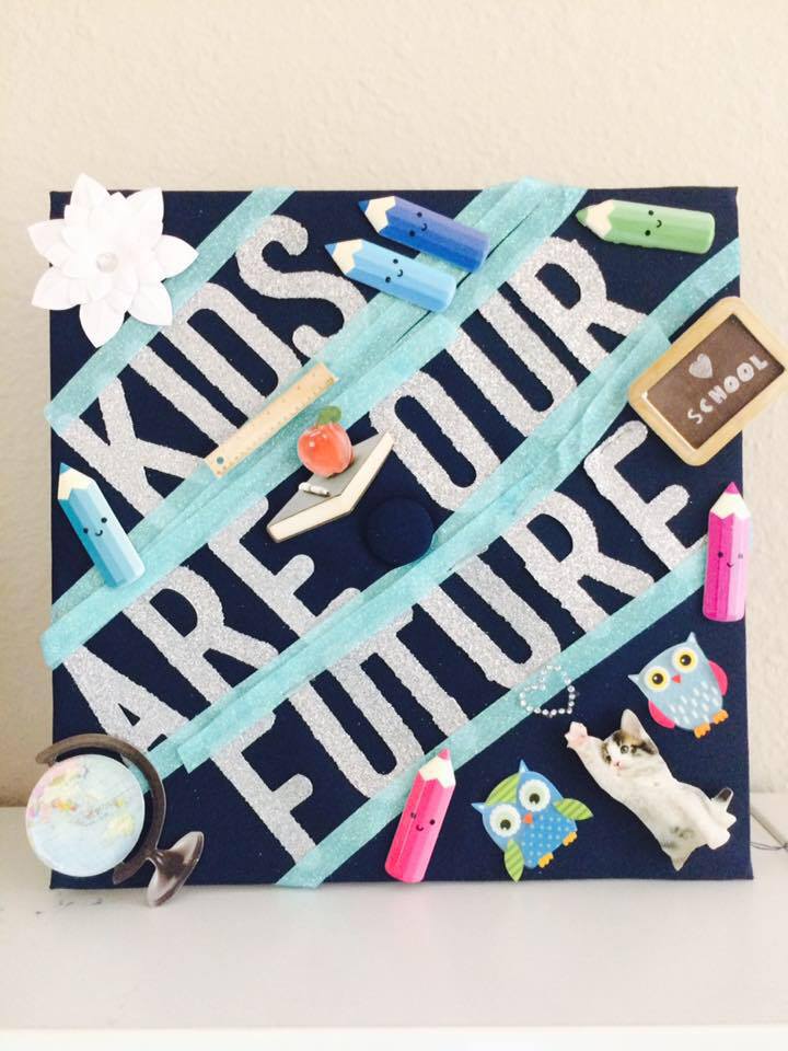 Bedazzled with tons of stickers, tape, and paint adhesive to keep it all on.